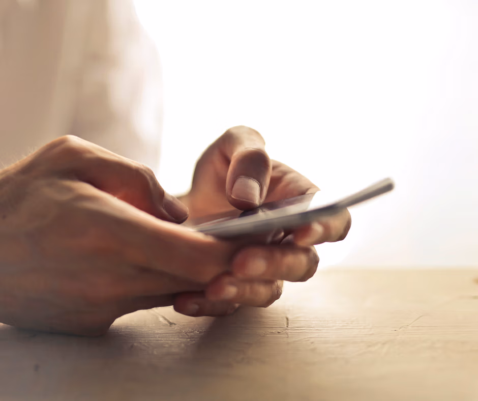 Photo of hands holding a phone